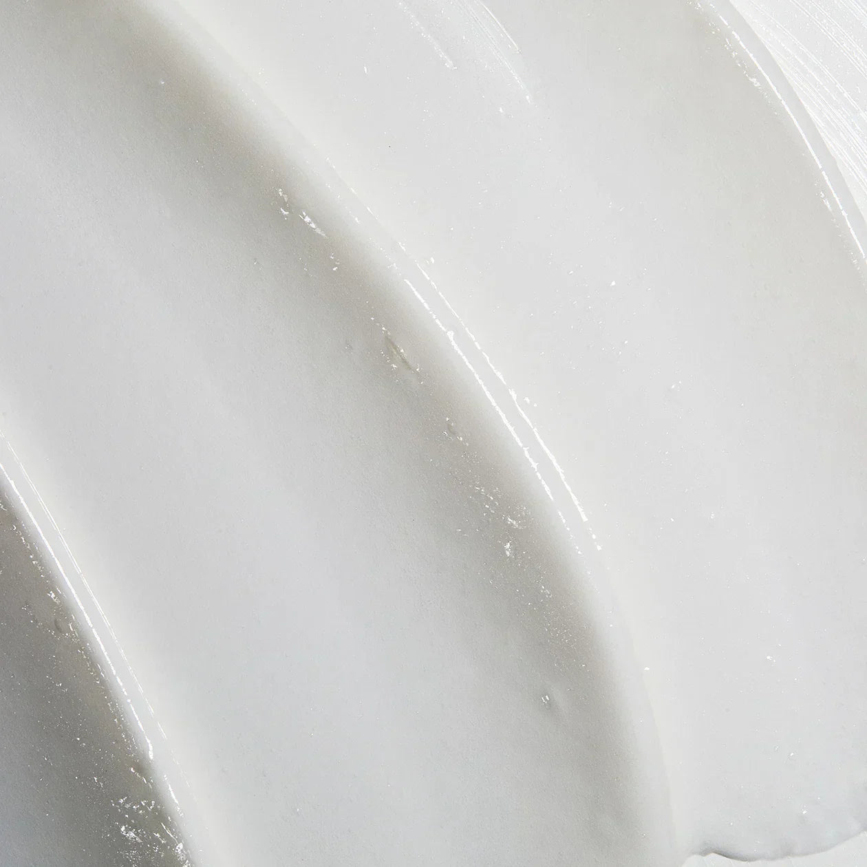 Close-up of a white cream texture with a glossy finish