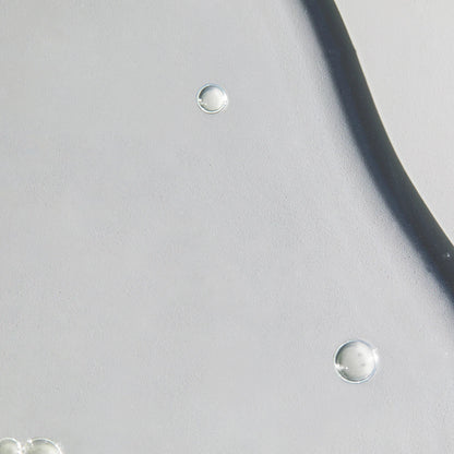 Close-up of silver earrings on a light gray background
